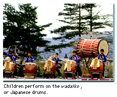 Children perform on the wadaiko, or Japanese drums.