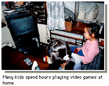 Many kids spend hours playing video games at home.