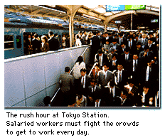 The rush hour at Tokyo Station. Salaried workers must fight the crowds to get to work every day.