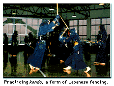 Practicing kendo, a form of Japanese fencing.