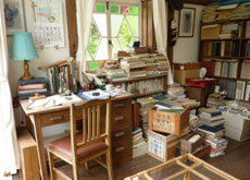 The study of Satsuki and Mei’s father is cluttered with books.