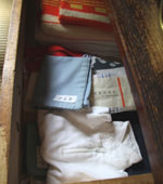 Dresser drawers filled with family clothing.