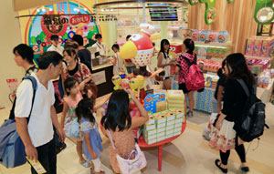 Choosing candy at Tokyo Okashi Land, a new attraction in Tokyo Station.