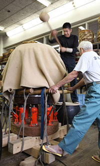 Jacks are used to stretch the cowhide to its limits in making wadaiko, one of the world’s most sturdy instruments. A heavy wooden hammer is used to repeatedly strike the instrument when to fine-tune its sound at Miyamoto-Unosuke Shoten.