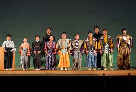 Children standing for applause at the end of a stage performance. (Photo courtesy of Toshima Future Culture Foundation.)