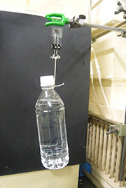 An experiment hanging a plastic bottle.