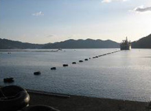 A work ship lays underwater cables to monitor earthquakes in real time.