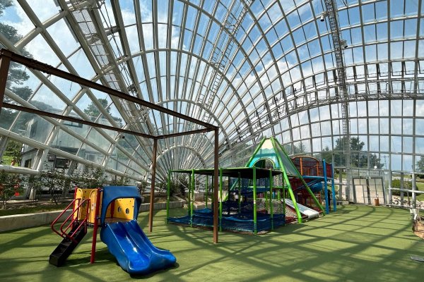 This play area is covered by a dome that lets you have fun in any weather.