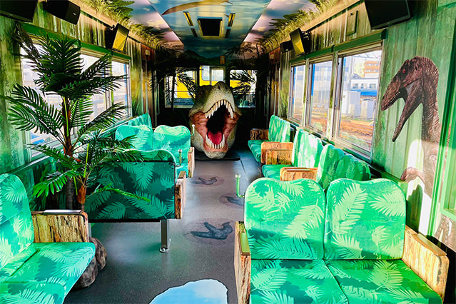 Interior  of the Echizen Railway’s Dino Liner featuring dinosaur-themed seats and decorations