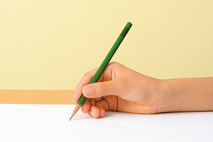 You hold a pencil slightly tilted with your thumb, index finger and middle finger.