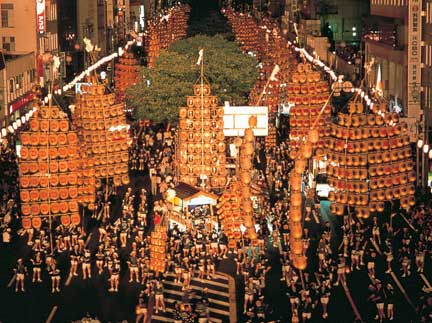 The Kanto Festival lights up the night sky.