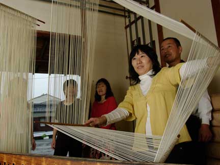 Visitors making somen, a Shodoshima specialty, at the Hirai Seimenjo noodle factory.