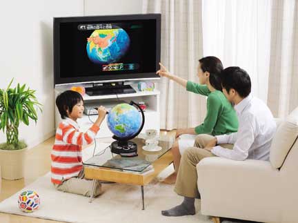 An image of a family enjoying the TV-Globe. (C)2009 EPOCH Co., LTD./ WATANABE KYOGU Co., Ltd.