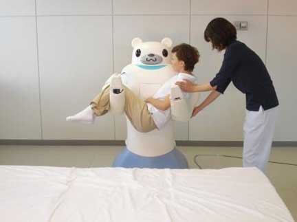 RIBA lifts a person. (C)RIKEN-TRI Collaboration Center for Human-Interactive Robot Research