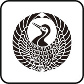 The top edge of a well, surrounded by trees (left) and an animal motif in the shape of a crane