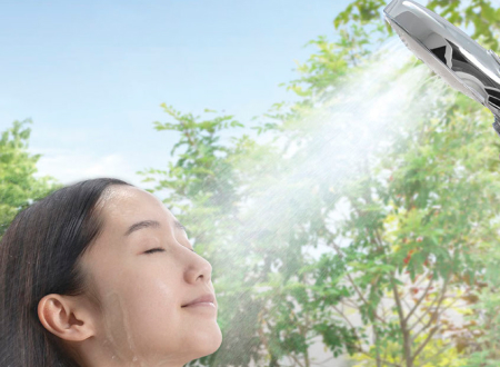 A person using the mist, enriched with ultrafine bubbles, for skin care. This showerhead also features a switch to change modes mid-shower, adding a water-saving benefit.